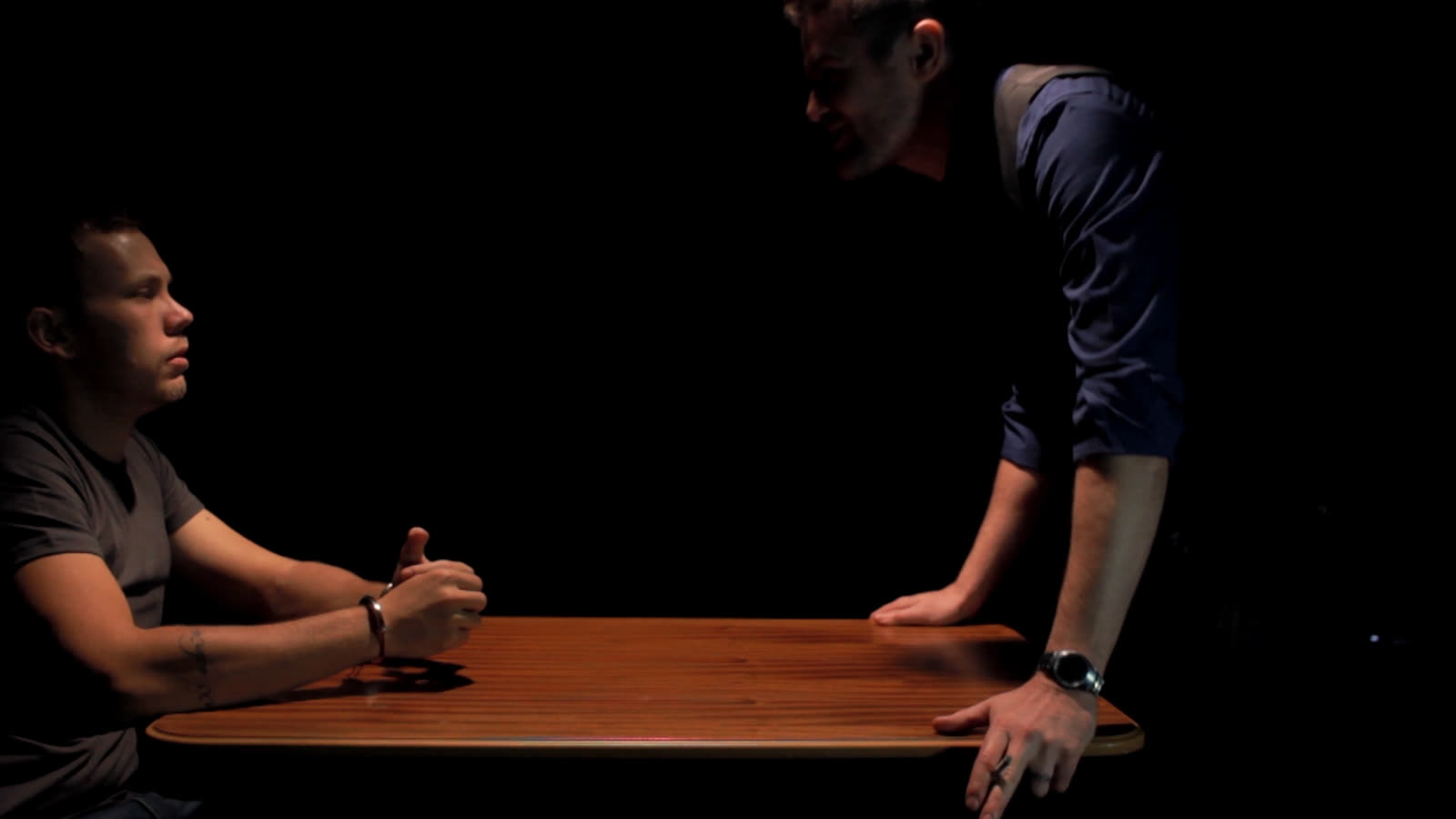 Still from Deep Down Inside — interrogation scene